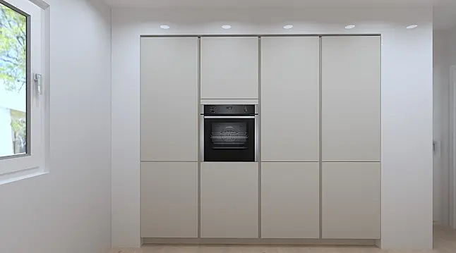 Eine elegante neue Küche mit einer Insel und Markengeräten von Miele